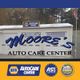 Moore's Auto Care Center building with logos for NAPA and ASE certification.