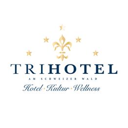 Logo von Trihotel mit Schriftzug "Hotel Kultur Wellness" und goldenen Sternen.