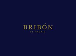 Texto dorado "BRIBÓN DE MADRID" sobre fondo azul oscuro.