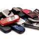 A pile of assorted old mobile phones, featuring various colors and designs.