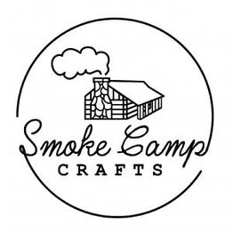 Logo of Smoke Camp Crafts with a log cabin and smoke rising within a circular border.