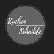 Grauer Kreis auf schwarzem Hintergrund mit der Aufschrift "Küchen Schaible".