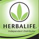 Logo di Herbalife con scritta "Independent Distributor" su sfondo verde e nero.