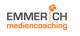 Logo mit der Aufschrift "Emmerich Mediencoaching" und einer grauen Lampe daneben.