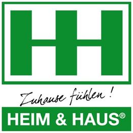 Grünes Logo von Heim & Haus mit Slogan "Zuhause fühlen!".