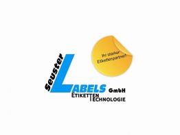 Logo von Seuster Labels GmbH mit gelbem Aufkleber: "Ihr starker Etikettenpartner!"