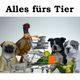 Statuetten von Tieren mit Einkaufswagen, darüber der Text „Alles fürs Tier“.