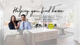Couple standing in a modern kitchen with text: "Helping you find home. Tropic Shores Realty."