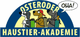 Drei Hunde mit Rucksäcken unter dem Schriftzug "Osteroder Haustier-Akademie", einer sagt "Oha!".