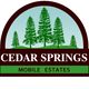 Logo of Cedar Springs Mobile Estates with green trees and text on brown and green background.