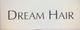 Text "Dream Hair" in schwarzer Schrift auf weißem Hintergrund.