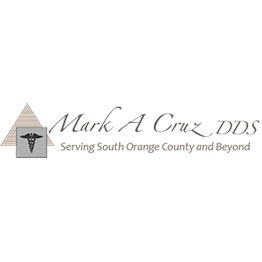 Logo for Mark A Cruz DDS, featuring a caduceus symbol and a triangle, with text below.