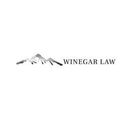 Logo of Winegar Law with a grayscale mountain design to the left.