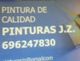 Póster de "Pinturas J.Z." con teléfono 696247830 y correo parcialmente visible.