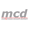 Logo mit grauen Buchstaben "mcd" und Text "messe consult dankert" darunter in kleiner Schrift.