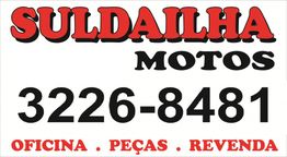 Banner com texto: Suldailha Motos. Telefone: 3226-8481. Oficina, peças, revenda.