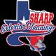 Texas-shaped logo for Sharp Exterior Cleaning, featuring a worker in red and blue colors.