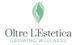 Logo con silhouette verde di un viso e testo: Oltre L'Estetica, Growing Wellness.