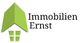 Logo von Immobilien Ernst mit grünem Hausdach und Fenster.