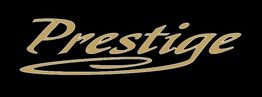 Schriftzug "Prestige" in goldener, geschwungener Schrift auf schwarzem Hintergrund.
