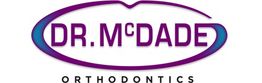 Logo reading "Dr. McDade Orthodontics" with purple and blue design elements.