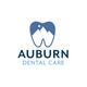 Logo of Auburn Dental Care with a tooth icon and mountain design.