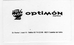 Paño con logotipo y dirección de Óptica Optimón en Castellar del Vallès, España.