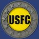 USFC emblem with stars on a circular silver border, yellow center, and blue background.