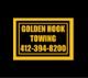 "Sign with text: Golden Hook Towing, 412-394-8200, in yellow and black."