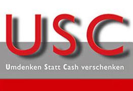 Text "USC Umdenken Statt Cash verschenken" in roten Buchstaben auf grauem und rotem Hintergrund.
