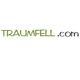 Text: "TRAUMFELL.com" in grüner und schwarzer Schrift auf weißem Hintergrund.