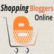 Shopping Bloggers Online logo with an orange shopping bag in a cart.