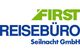 Logo: "First Reisebüro Seilnacht GmbH" in grüner und blauer Schrift auf weißem Hintergrund.