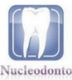 Logotipo de un diente blanco sobre fondo azul. Texto: Nucleodonto.