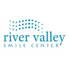 Logo of River Valley Smile Center with blue dots forming a wave.