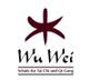Logo von Wu Wei, Schule für Tai Chi und Qi Gong, mit stilisiertem roten Sternsymbol.