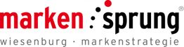 Rotes und schwarzes Logo "marken:sprung", darunter "wiesenburg · markenstrategie".