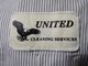 Badge reading "United Cleaning Services" with an eagle design on a striped fabric background.