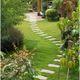 Garden path with stepping stones, surrounded by lush green plants and manicured bushes.