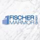 Logo mit blauem Text "Fischer Marmor GmbH" auf weißem Marmorhintergrund.