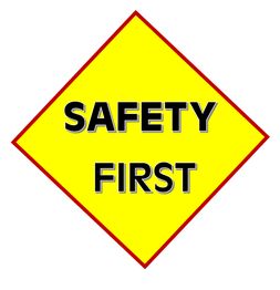 Gelbes Raute-Schild mit rotem Rand und schwarzer Aufschrift: "SAFETY FIRST".