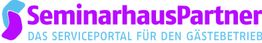 Logo von SeminarhausPartner in Blau und Lila mit dem Text "Das Serviceportal für den Gästebetrieb".