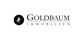 Logo von Goldbaum Immobilien mit Baum-Symbol in Schwarz und Gold.