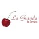 Logotipo "La Guinda de Serrano" con una cereza roja al lado.