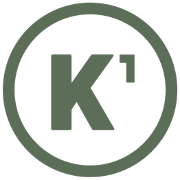 Ein schwarzer Kreis mit einem großen Buchstaben "K" und einer kleinen hochgestellten "1".