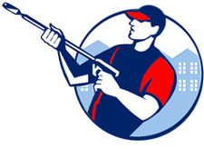 Man in red and blue uniform holding a pressure washer, with buildings in the background.