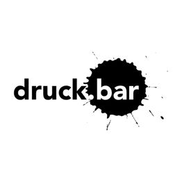 Schwarzer Farbfleck mit dem Wort "druck.bar" auf weißem Hintergrund.