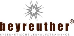Logo mit stilisiertem Stern darüber "beyreuther Kybernetische Verkaufstrainings".