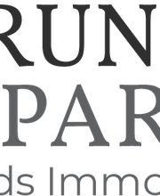 Grunwald & Partner - Immobilienmakler Husum, Sylt, St. Peter - Ording Logo