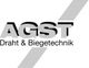 Logo von AGST Draht & Biegetechnik mit grauem diagonalem Streifen im Hintergrund.